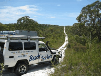 Beach trekkers North Stradbroke Island - VIC Tourism